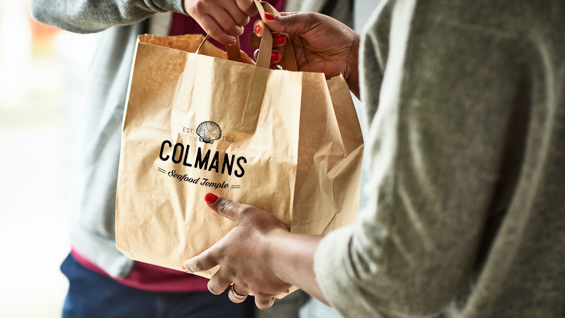 Close up of woman receiving take away food delivery